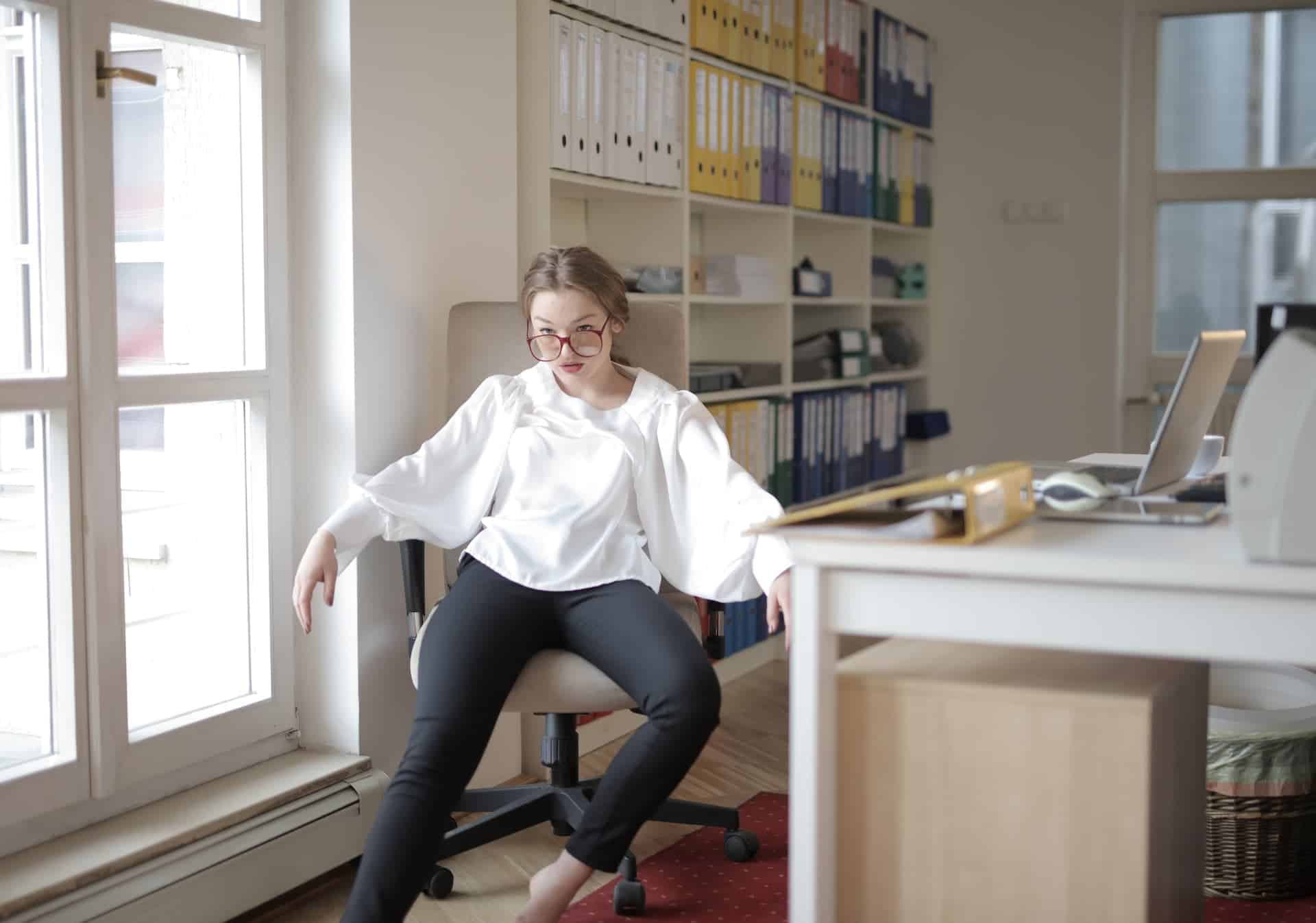 businesswoman slouched in her office chair looking frustrated